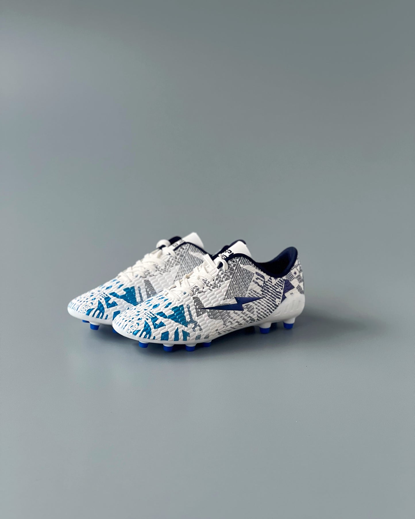 SPIKA LIGER FIRM GROUND BOOTS WHITE/BLUE