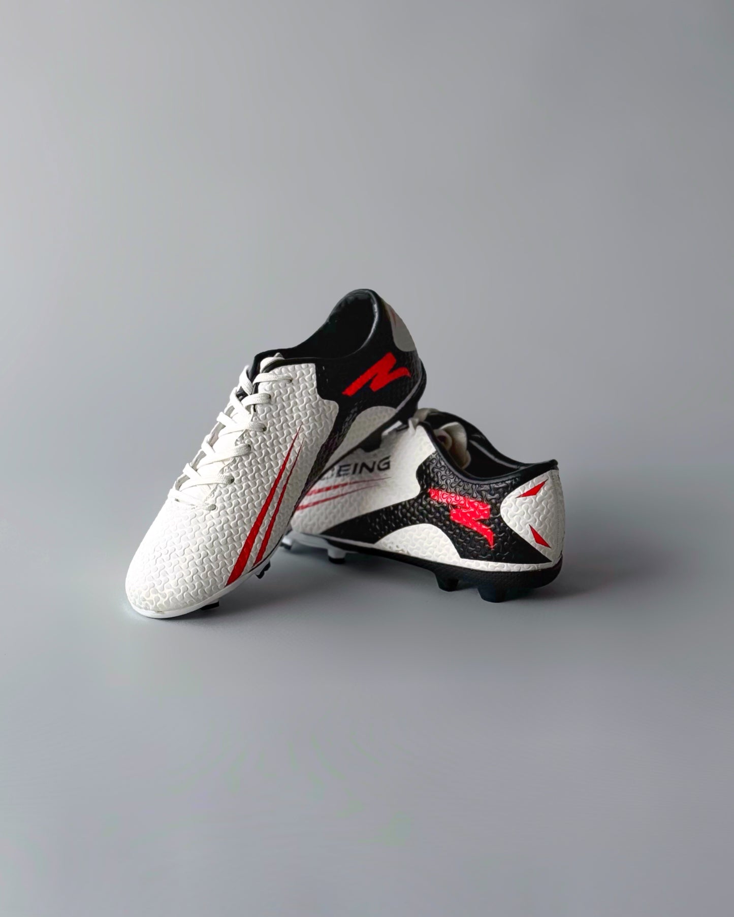 FELO BOEING FIRM GROUND FOOTBALL BOOTS BLACK/WHITE