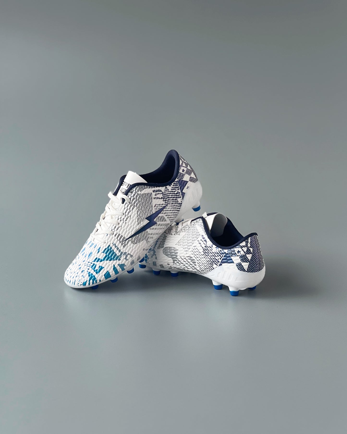 SPIKA LIGER FIRM GROUND BOOTS WHITE/BLUE