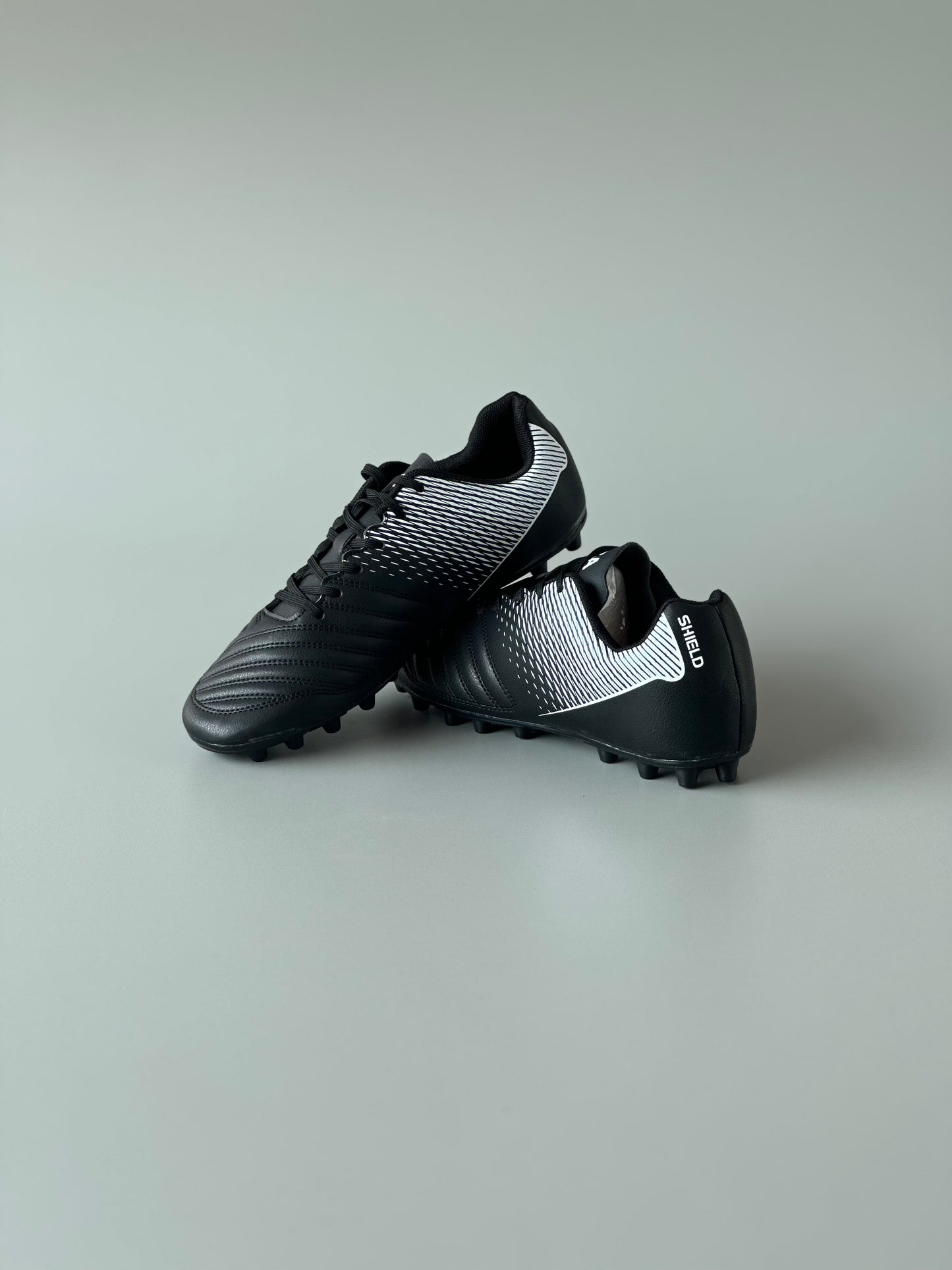 ANZA SHIELD MULTI GROUND FOOTBALL BOOTS BLACK